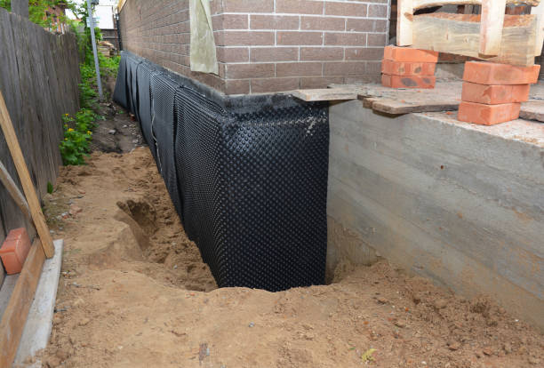 Happy homeowners after waterproofing job in Slayden